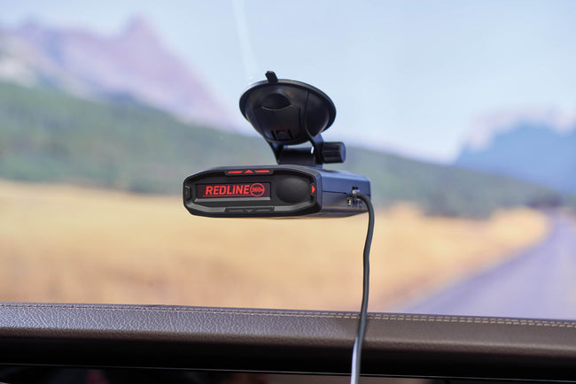 redline 360c mounted with cord attached on windshield